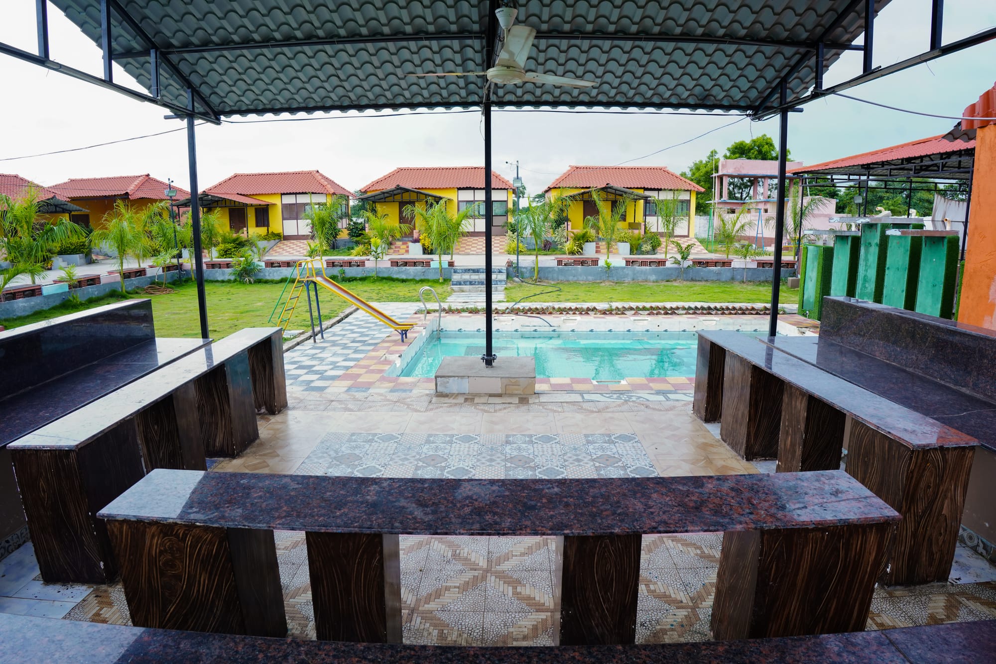 COTTAGES,LAWN AND POOL