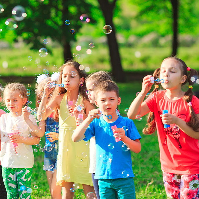 children bubble party kids blowing bubbles