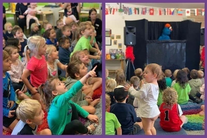 Group of young children holding puppets and posing in front of a puppet stage after a daycare puppet show in Toronto