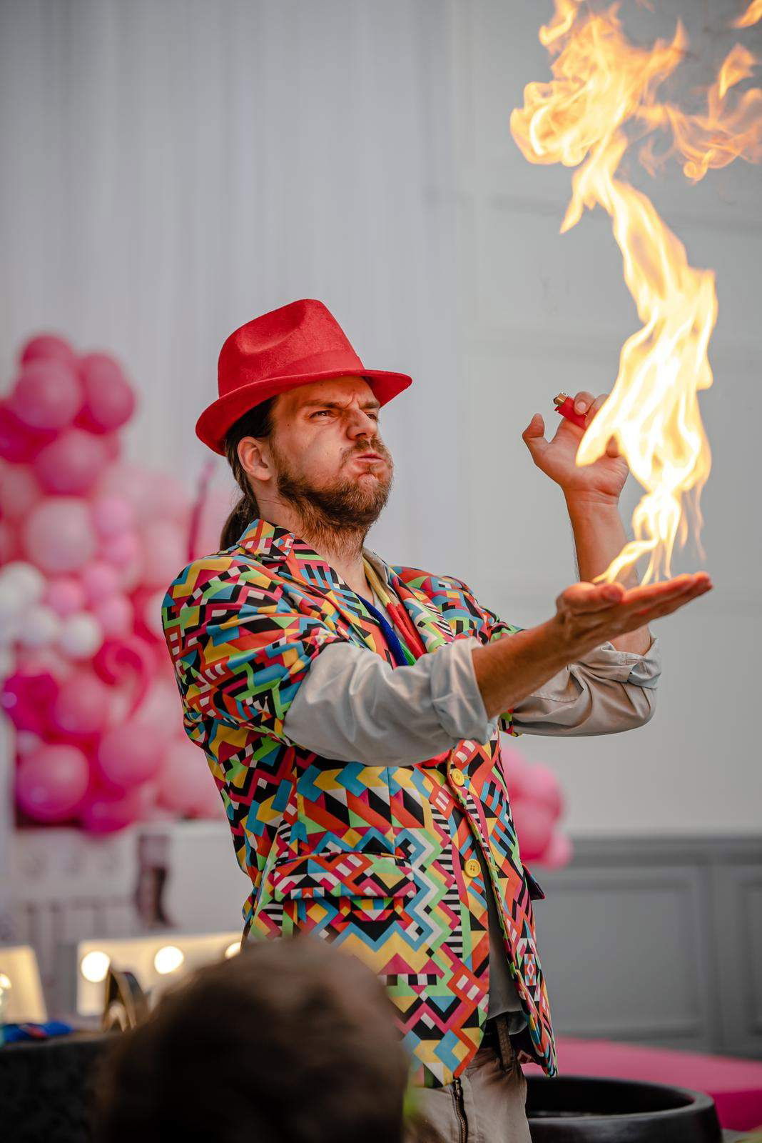 Entertainer performing a fire trick during a kids magic show in Toronto, creating an exciting and interactive experience for children.