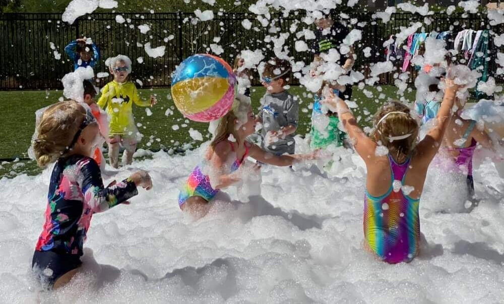 Children enjoying an outdoor kids foam party in Toronto with safe foam, music, and interactive summer fun