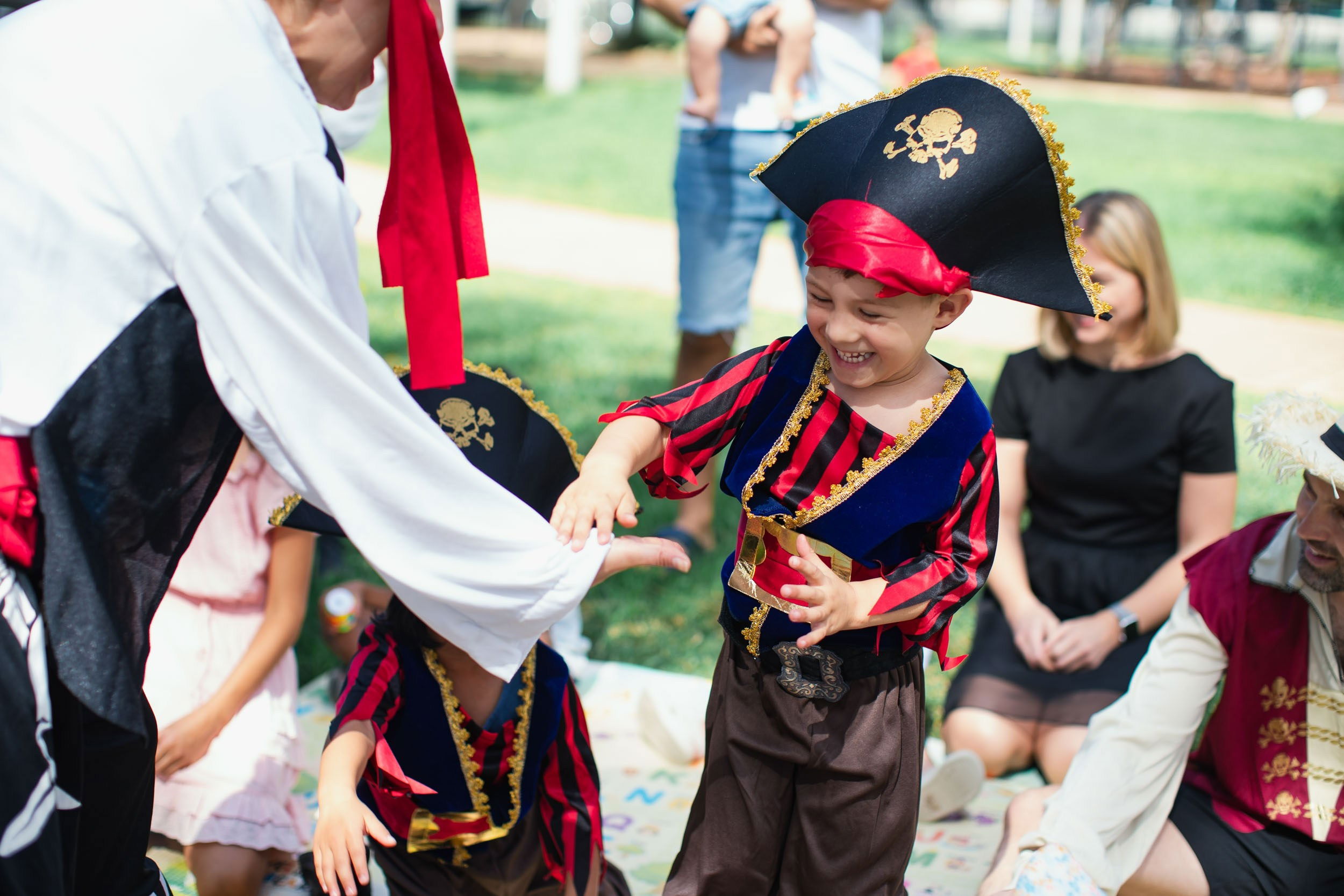 Children taking part in an outdoor pirate entertainment activity during a daycare program in Toronto