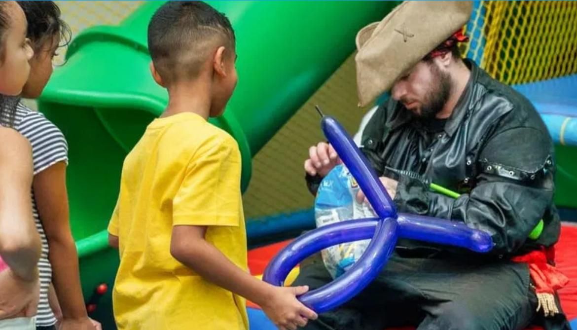 Pirate party entertainer creating balloon art for children during a kids birthday party in Toronto