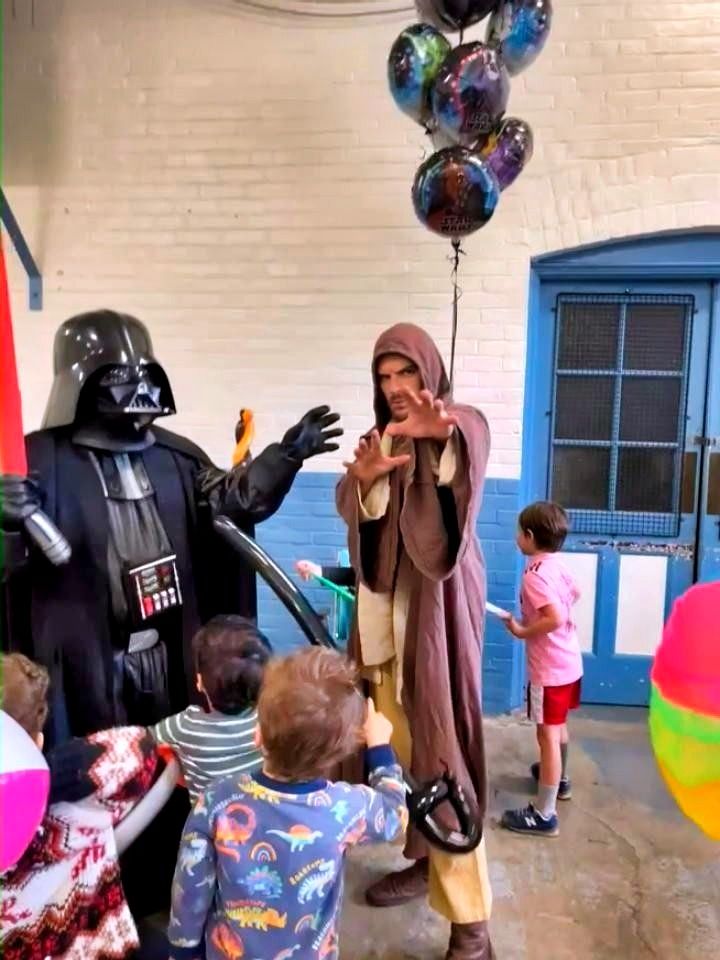 Themed adventure party characters interacting with children during a kids training activity