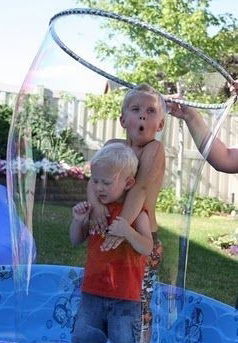 Child inside giant bubble show Toronto”