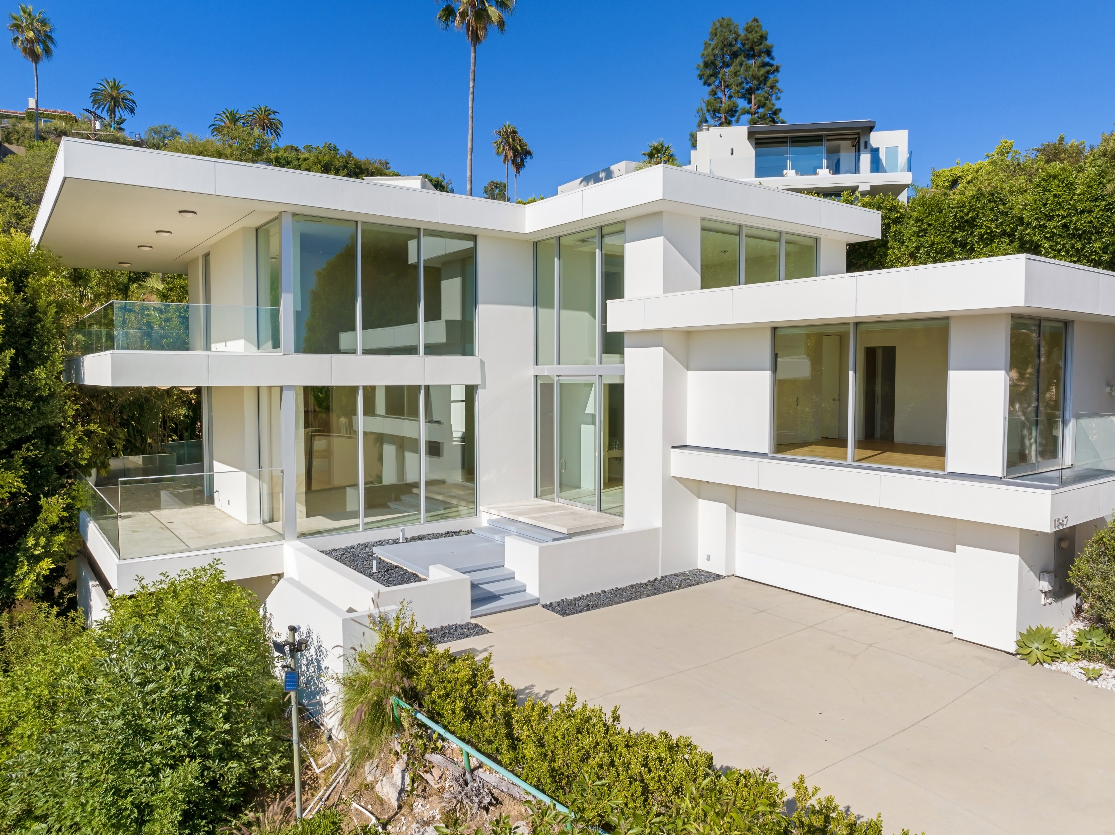 A large cliffside white colored mansion in Malibu, California.
