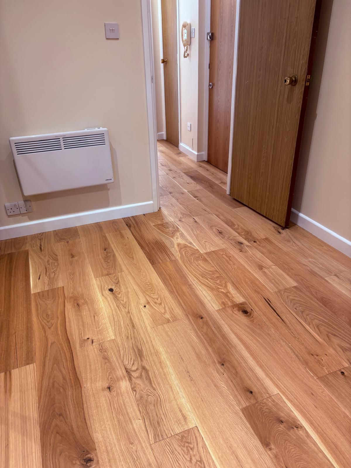 Opened up kitchen to lounge, removed stud wall, redecoration and new engineered wood floor and skirting throughout..