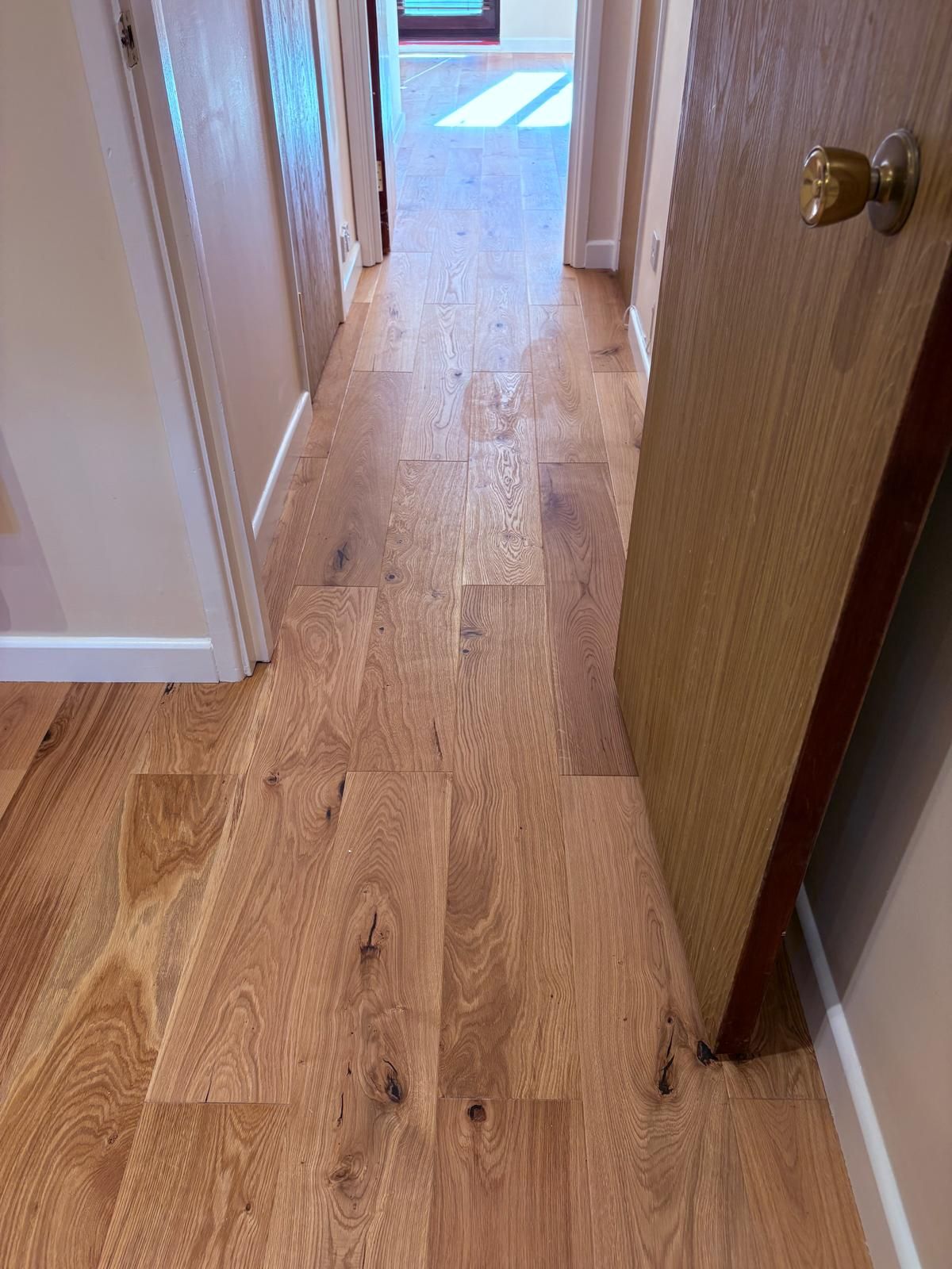 Opened up kitchen to lounge, removed stud wall, redecoration and new engineered wood floor and skirting throughout..