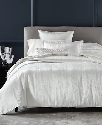 Modern black and white duvet cover on a king-size bed