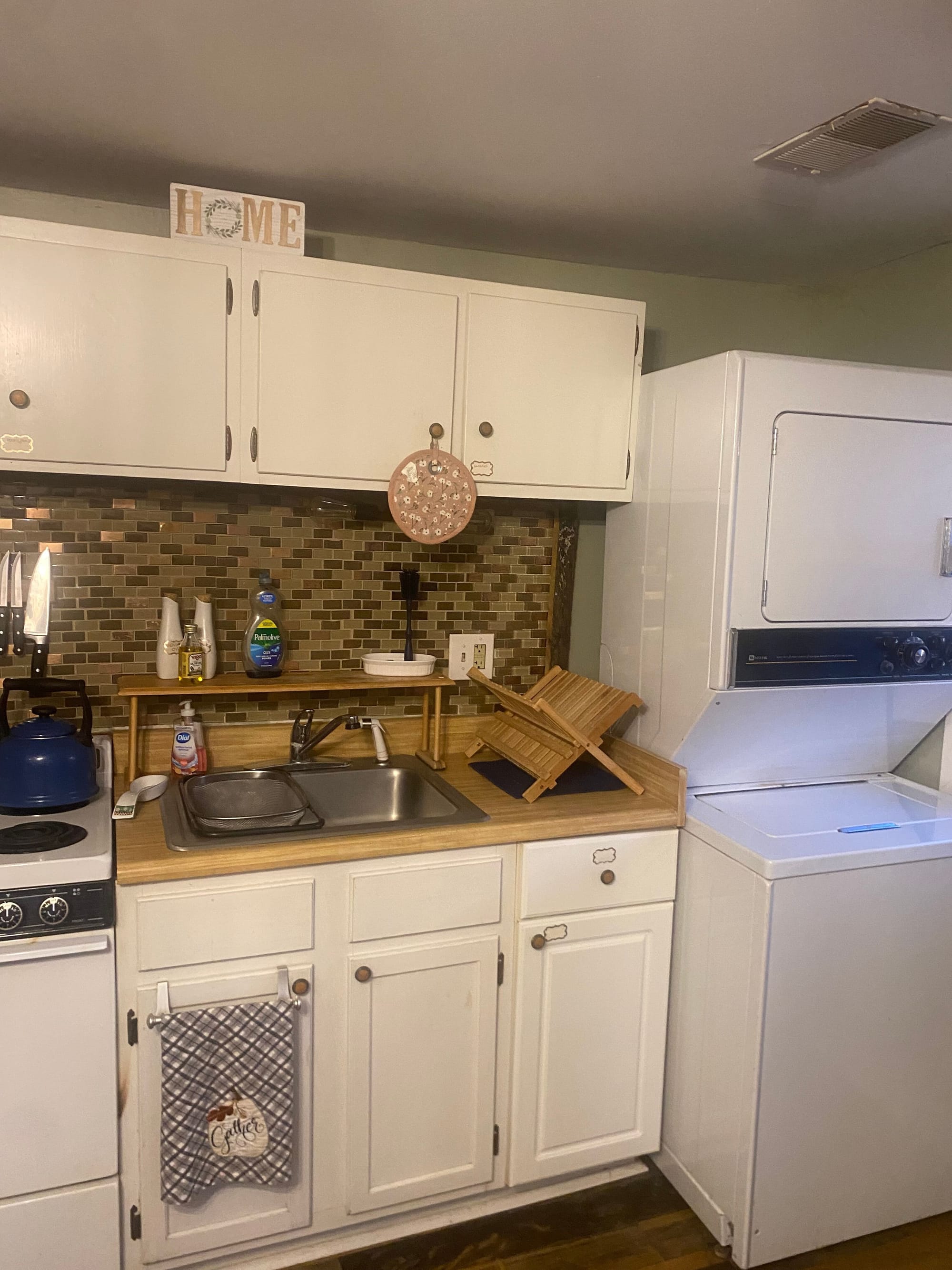 Kitchen - stove, sink, full size refrigerator, washer and dryer