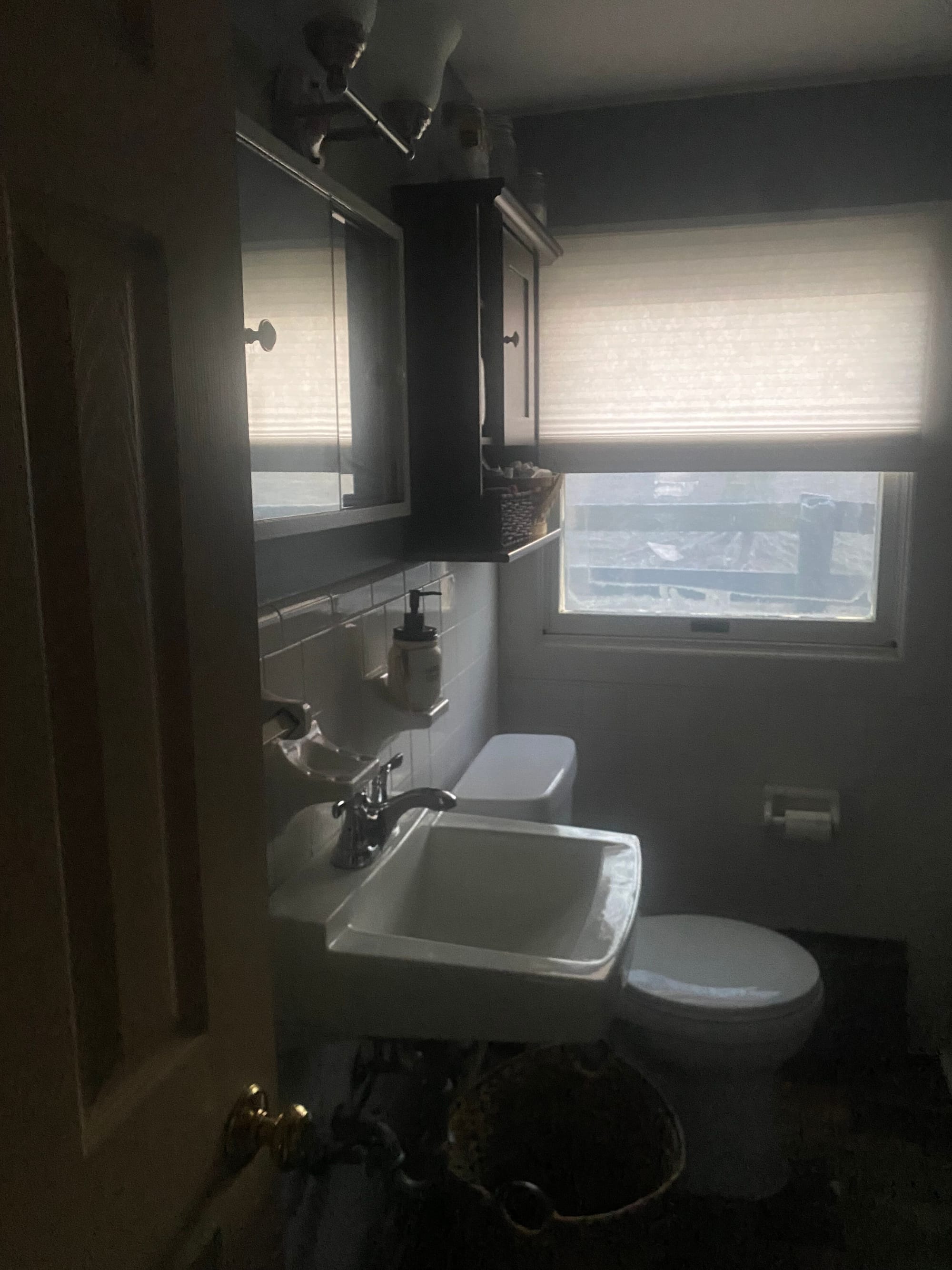 Bathroom - toilet and sink plus essentials