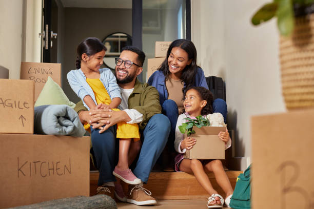 Family unpacking boxes in a new home