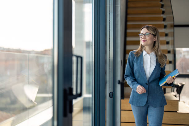Professional walking through an office lobby