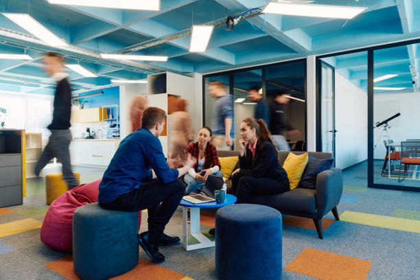 Young worker on a laptop in a co-working space