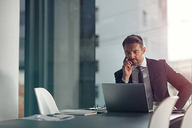 Professional reviewing documents at a desk