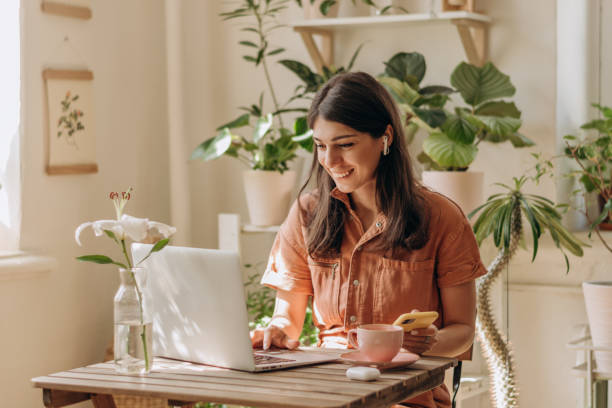 Young professional smiling in a home office