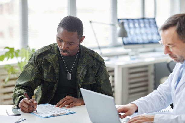 Veteran signing a document with an advisor