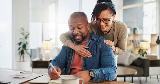 Veteran and spouse reviewing finances together