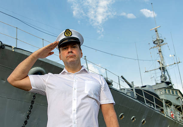 Navy veteran in uniform aboard a ship or dock