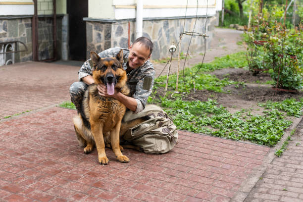 Veteran with a service dog at home