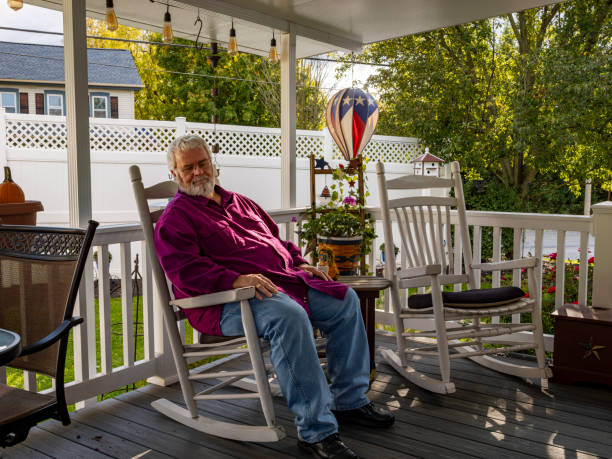 Older veteran relaxing on a porch