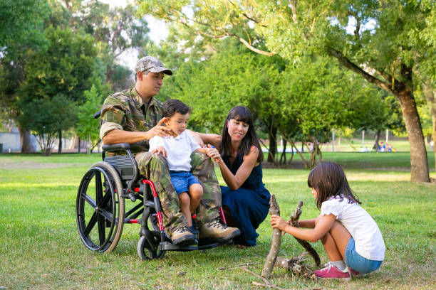 Military family gathered together at park