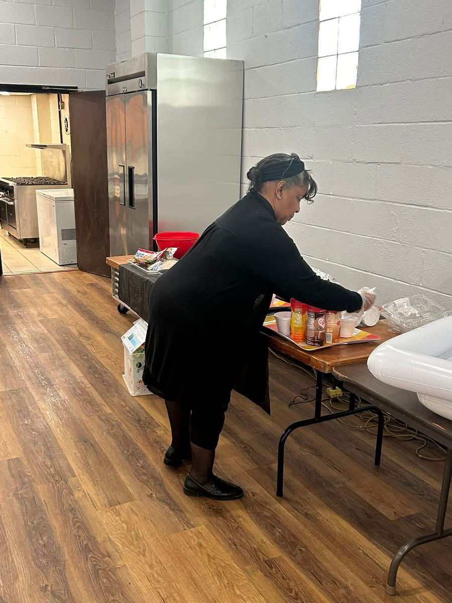 Sis. Carolyn Norbeck setting up for breakfast after Church School